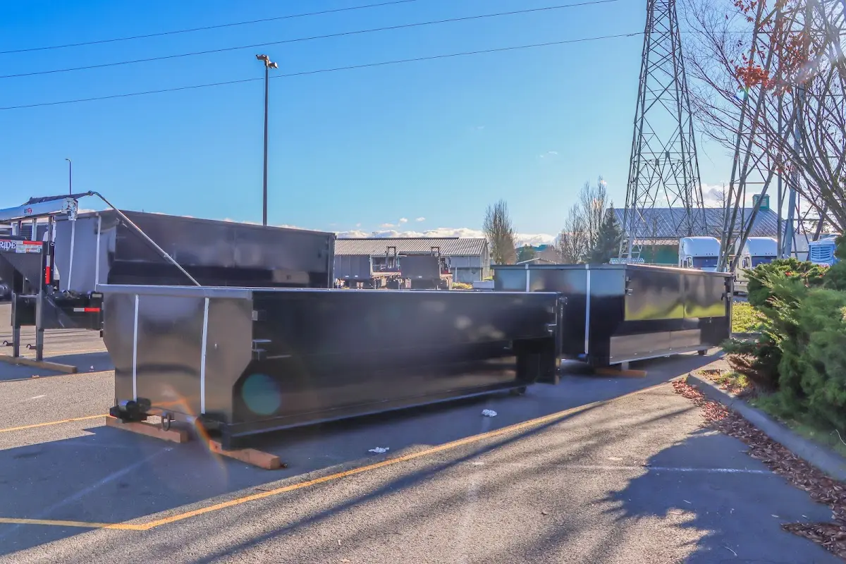 Roll-off dumpster ready for waste disposal at job site for Roofing Dumpster Rental in Tontitown